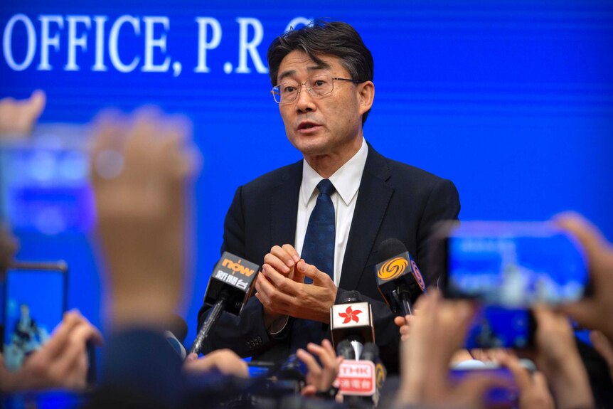Gao Fu, the head of the Chinese Center for Disease Control and Prevention, speaks to journalists at a press conference.