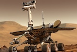 A concept image shows a solar powered NASA rover with six wheels on the surface of Mars.