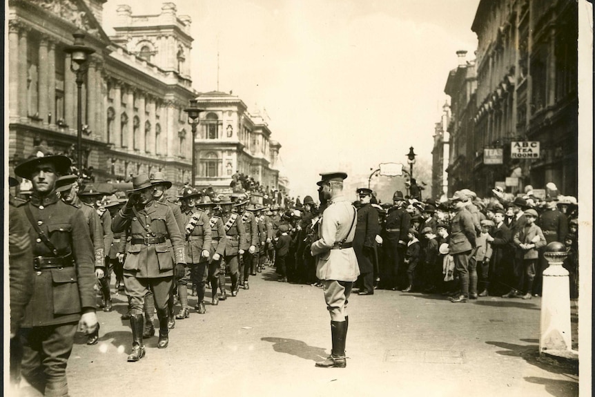 Soldiers salute.