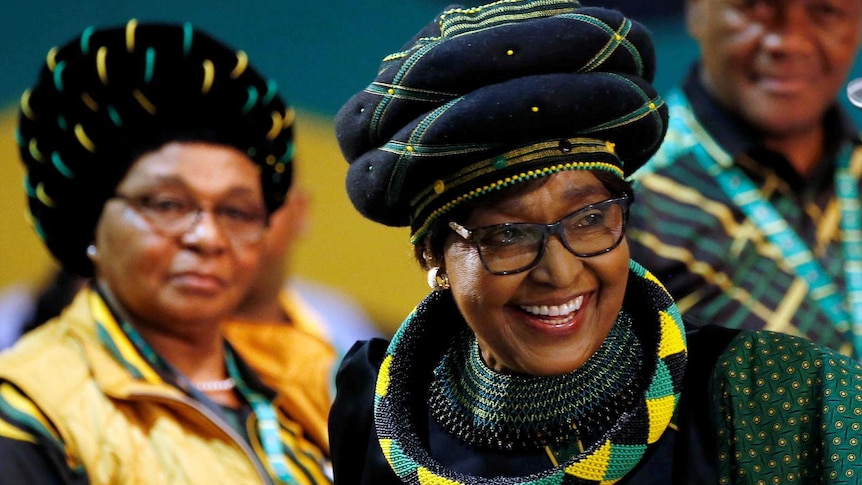 Winnie Mandela smiles as she arrives for the 54th ANC national conference.