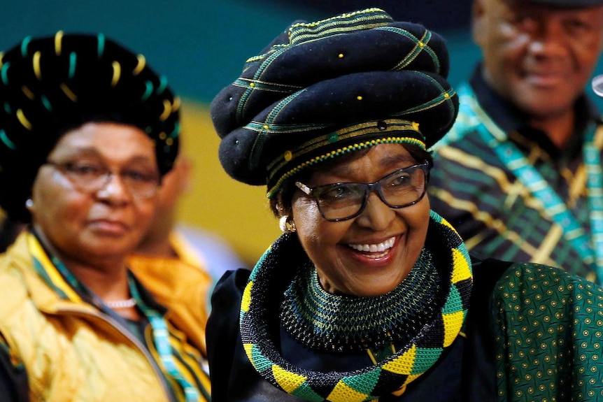 Winnie Mandela smiles as she arrives for the 54th ANC national conference.