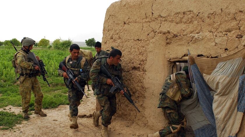 Australian-trained Afghan National Army engineers rush into a compound of interest.