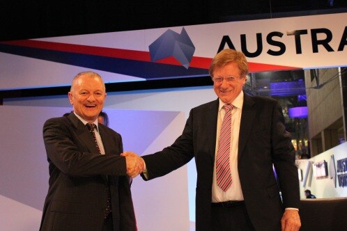 Antony Green shakes the hand of Kerry O'Brien, as both smile widely.