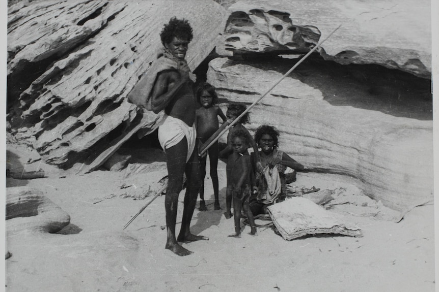 An Indigneous man, woman and three children posing for a photo.