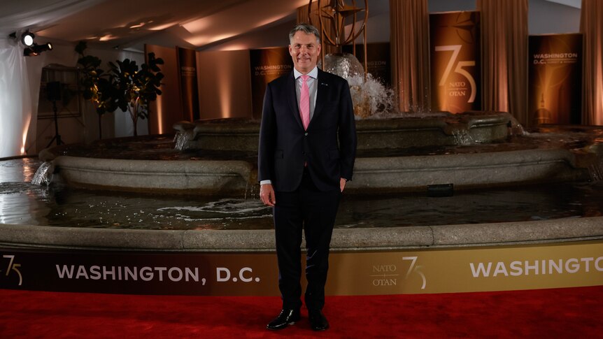 Richard Marles stands alone at the NATO conference in Washington DC