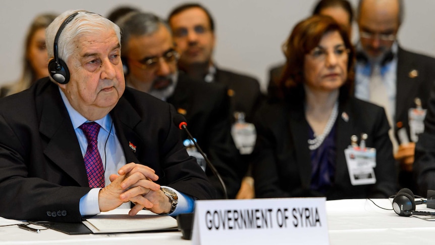 Syrian foreign minister Walid Muallem and his delegation at the Geneva II peace talks