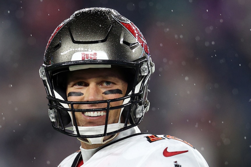 Tom Brady #12 of the Tampa Bay Buccaneers smiles during warmups before the game