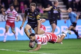 A Wigan player dives to score a try against Penrith in the World Club Challenge.