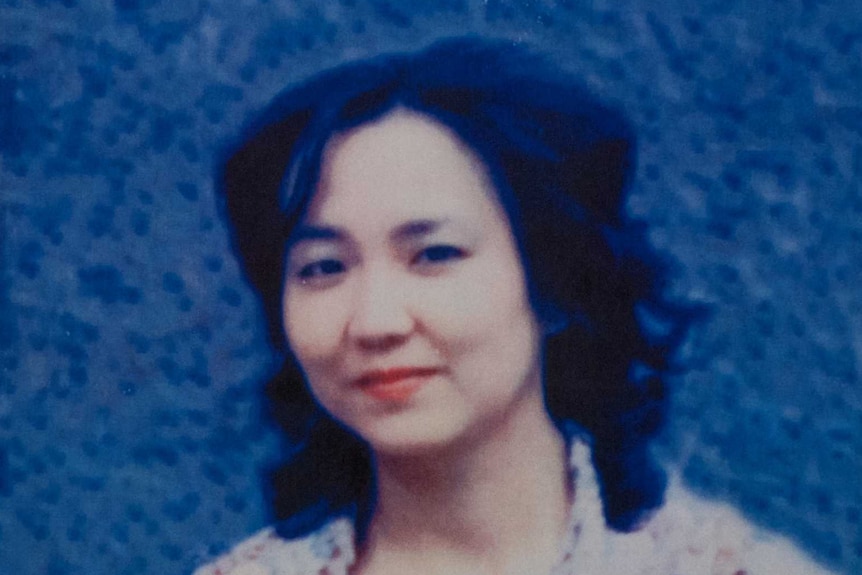 A blurry old photo of a young Japanese woman
