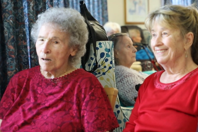Beryl Goddy and Cathy Garvie sit together at the North Rockhampton Nursing Centre.