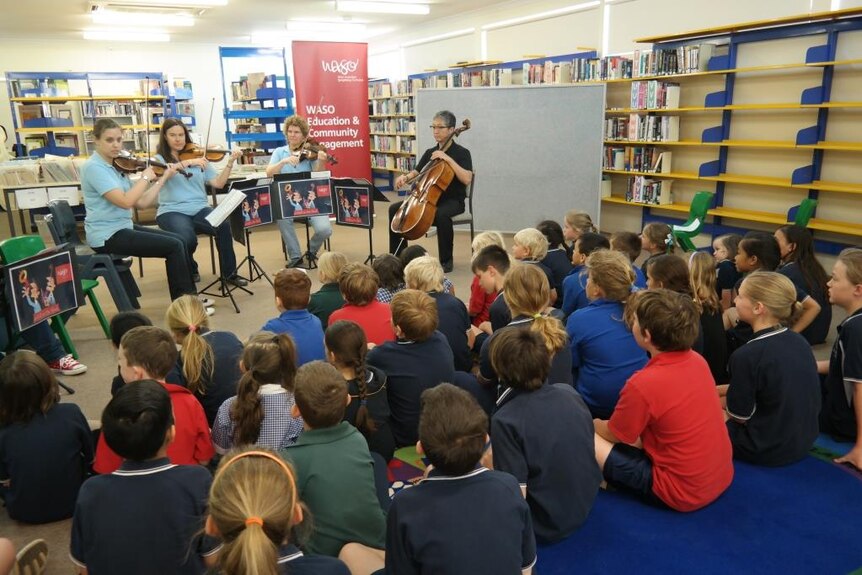 Members of the West Australian Symphony Orchestra perform for students at Leinster Community School.