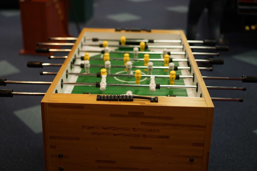 An end-to-end shot of a fusball table