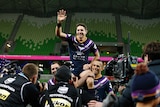 Billy Slater of the Storm is chaired off the ground after the Preliminary Final against Cronulla.
