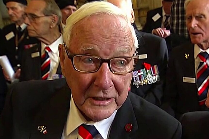 Legion of Honour recipient Bill Evans speaks to reporters after receiving the Honour.