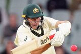 Marnus Labuschagne grimaces as he pulls the pink ball during a day-night Test
