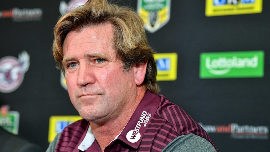 Close-up of Des Hasler during a press conference.