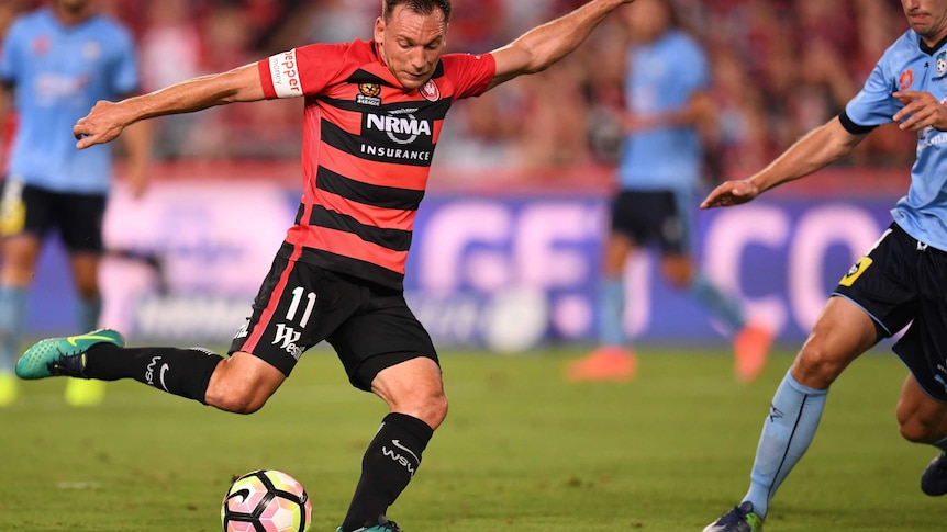 Wanderers player Brendon Santalab prepares to kick during the Sydney derby