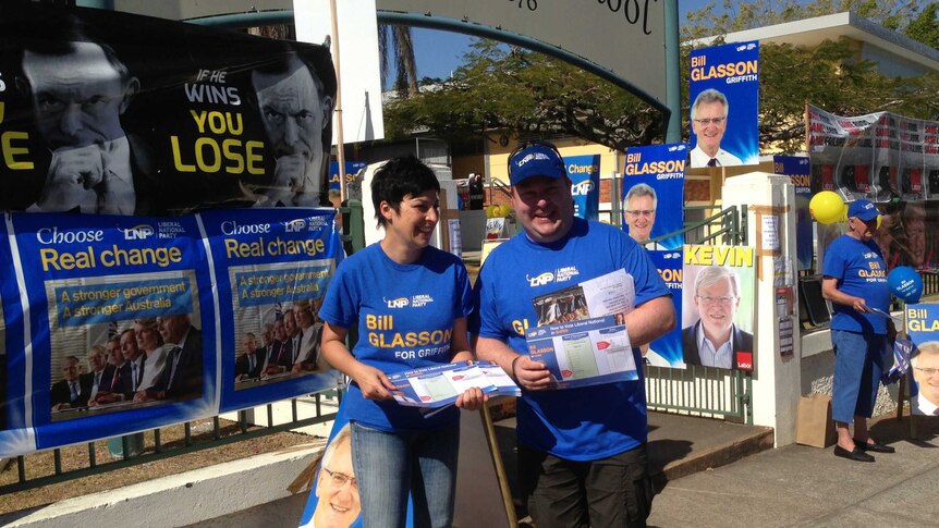 Lisa Newman works outside the Coorparoo polling booth in Brisbane on election day.
