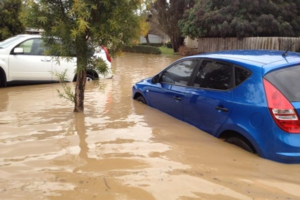 Two cars stuck in floodwaters