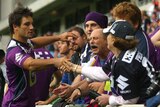 Outpouring of support: Cooper Cronk greets Storm fans at training today.
