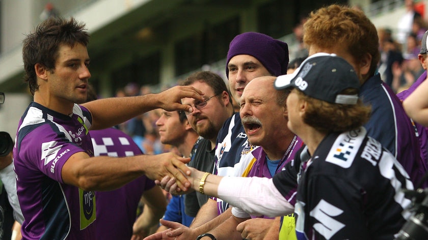 Outpouring of support: Cooper Cronk greets Storm fans at training today.