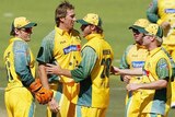 Team-mates congratulate Glenn McGrath.