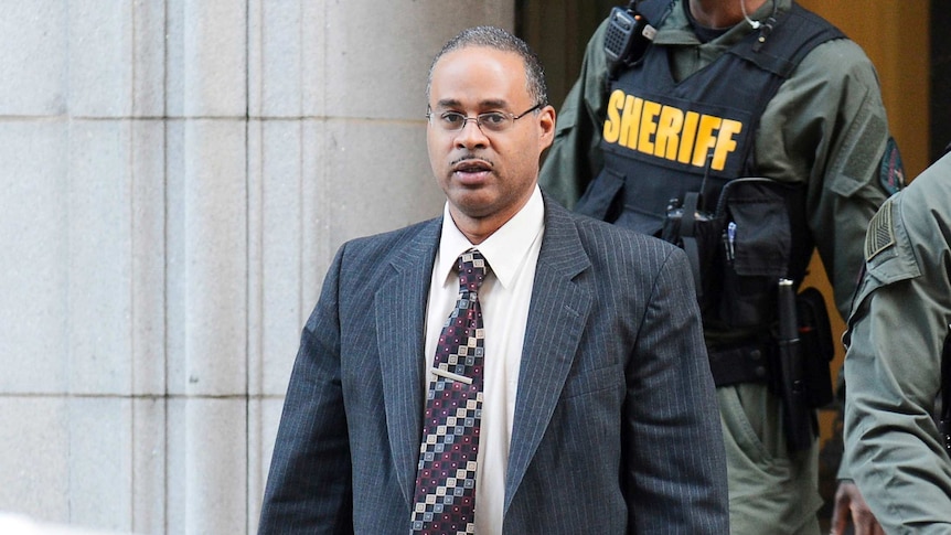 Baltimore Police officer Caesar Goodson leaves the courthouse.