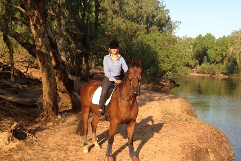 A young girl on a horse. 