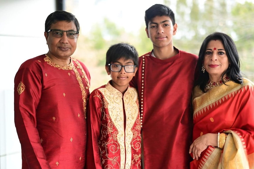 A family of four decked in outfits of the same colour