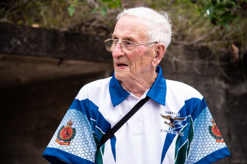 Elderly man in white and blue polo shirt