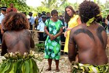 Prince William (R) and his wife Catherine watch traditional dancers perform in Honiara.
