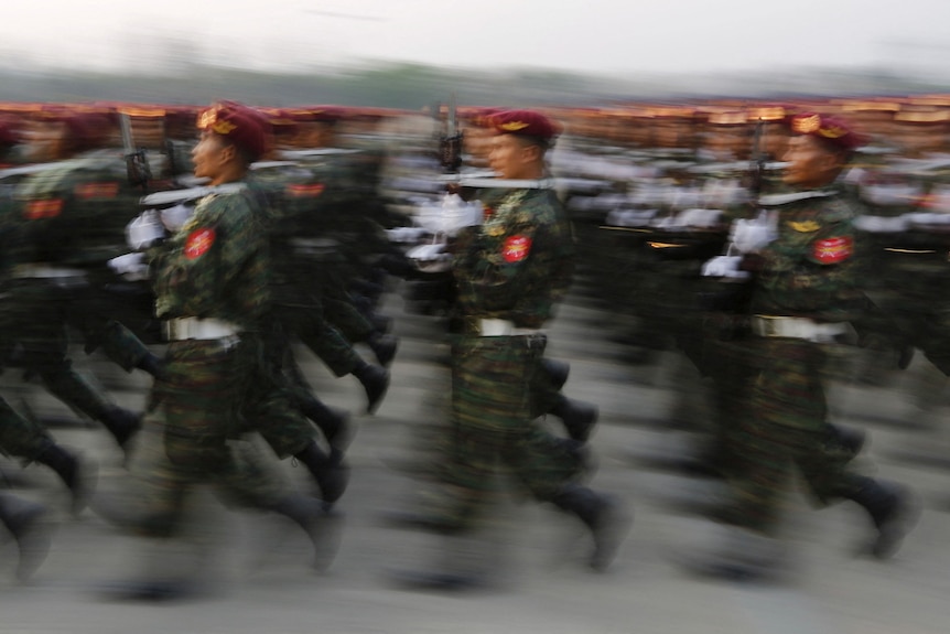 A blurry image of soliders marching