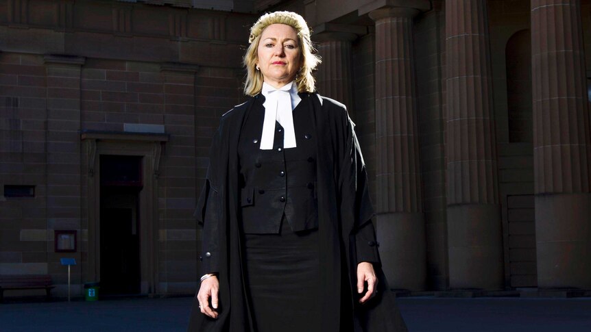 Upper body photo of Margaret Cunneen in her wig and robes outside court.