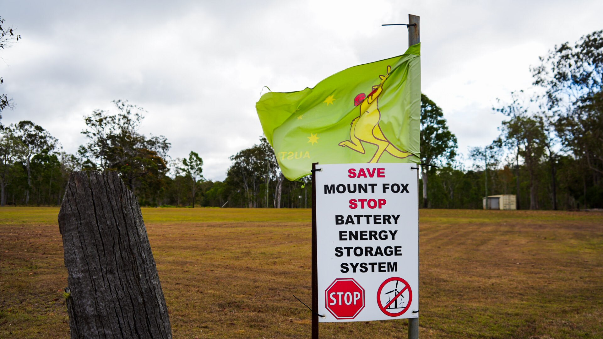 A poster opposing the wind farm and an Australian boxing kangaroo flag at Mount Fox oval.