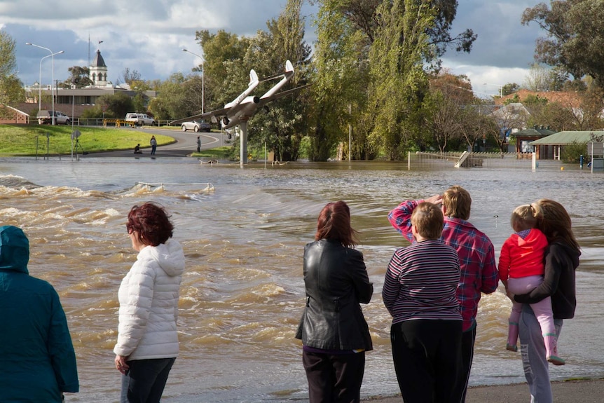 People watch the rising floodwater at Lake Forbes, Forbes, NSW