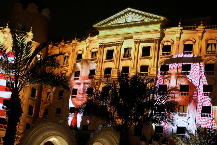 Pictures of Mr Trump and King Salman were projected onto the Ritz-Carlton, where Mr Trump is staying in Riyadh.