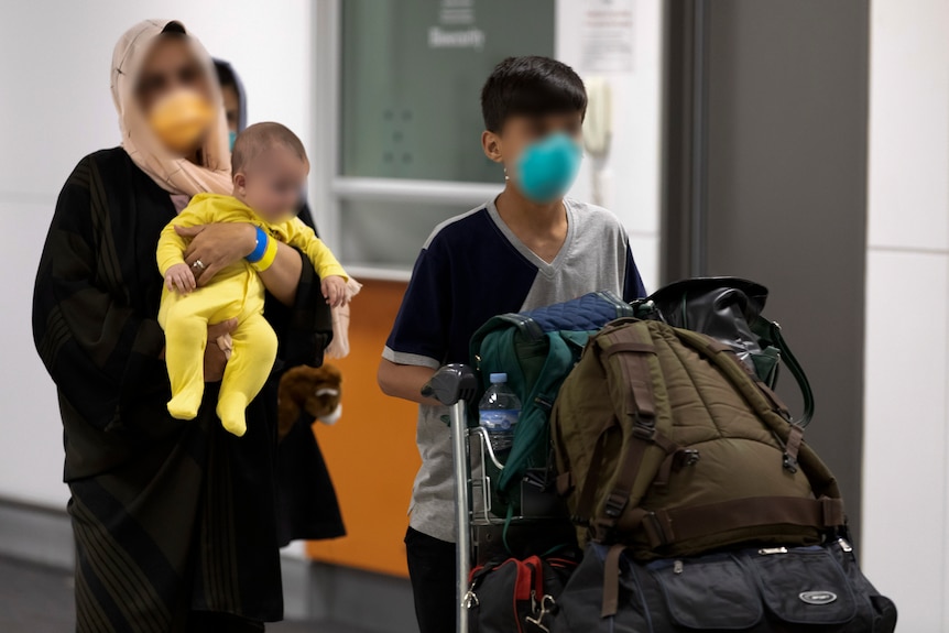 Afghan woman and children at Australian airport