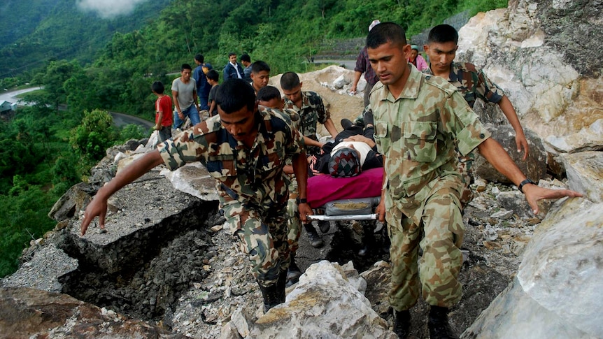 Rescuers dug through mudslides on roads to isolated Himalayan villages in search of survivors