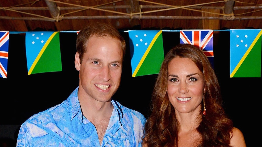 Britain's Prince William and wife Catherine pose for a photo in Honiara