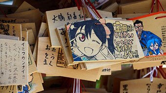 Shinto anime on wooden signs.