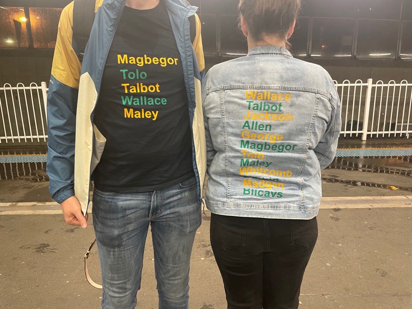 Two people (heads cropped) wear jackets with the names of Australian Opals players including Magbegor, Tolo, Talbot, Wallace