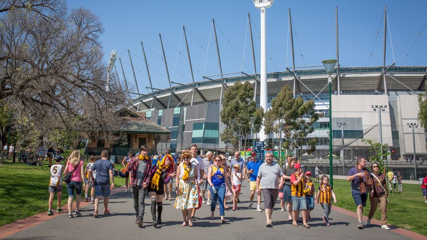 Footy fans leave the MCG after the 2015 Grand Final parade