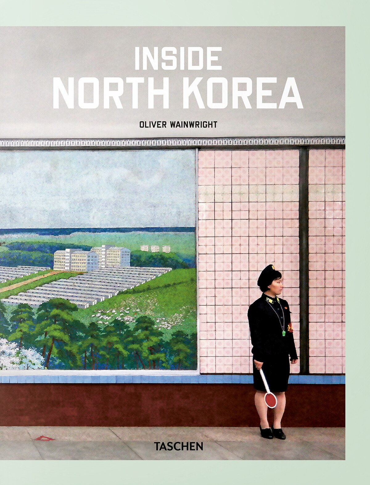 Colour scan of Insider North Korean book cover featuring a government worker standing in front of a pink tiled wall and mural.