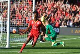 Adelaide's Bruce Kamau reacts after goal against Western Sydney Wanderers in A-League Grand Final.