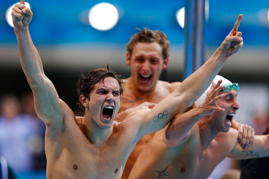 The French freestyle relay team celebrate as they win gold at the London Olympics.