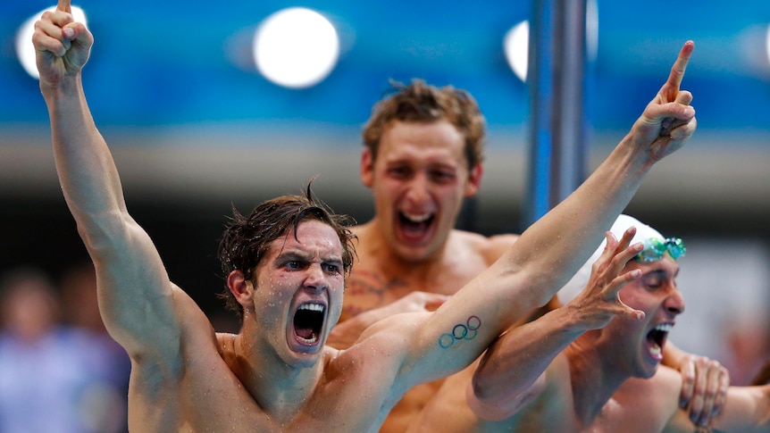 The French freestyle relay team celebrate as they win gold at the London Olympics.