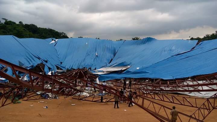 People gathered at the site of a collapsed church in Uyo