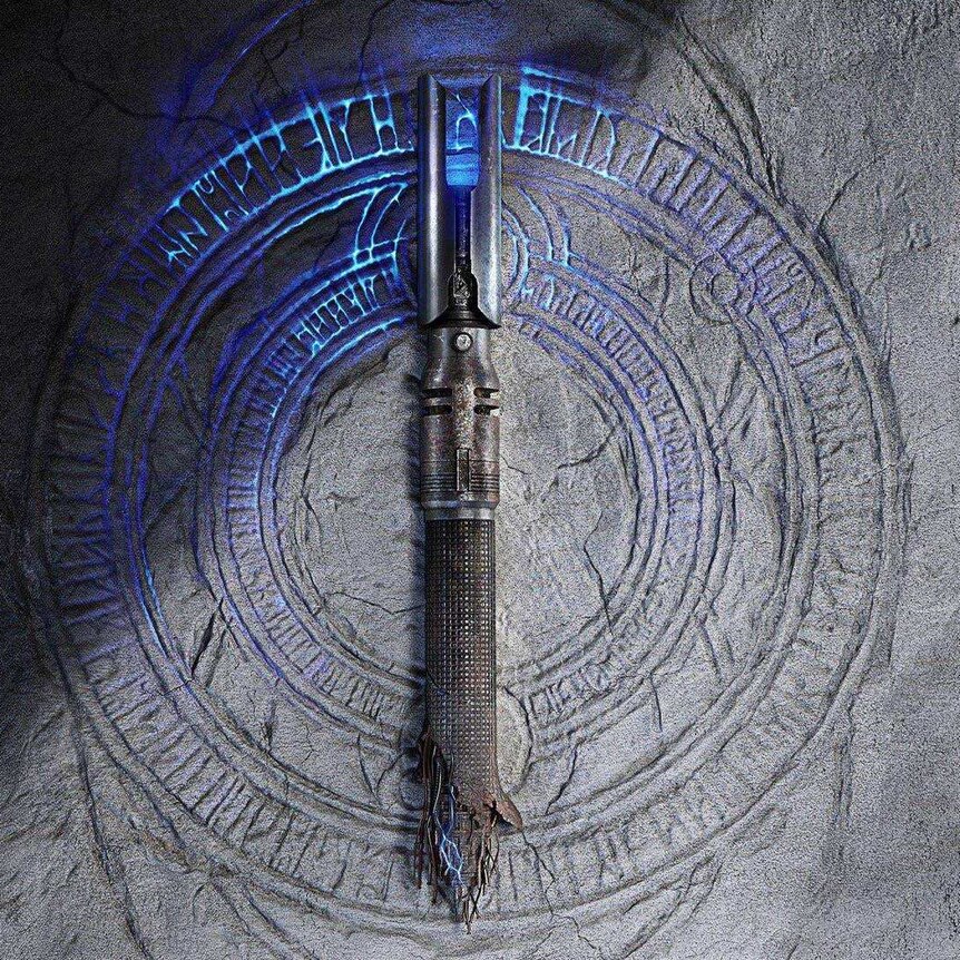 A broken lightsaber set against a glowing rock with mysterious inscriptions.
