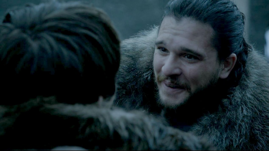 Jon smiles after embracing Bran.