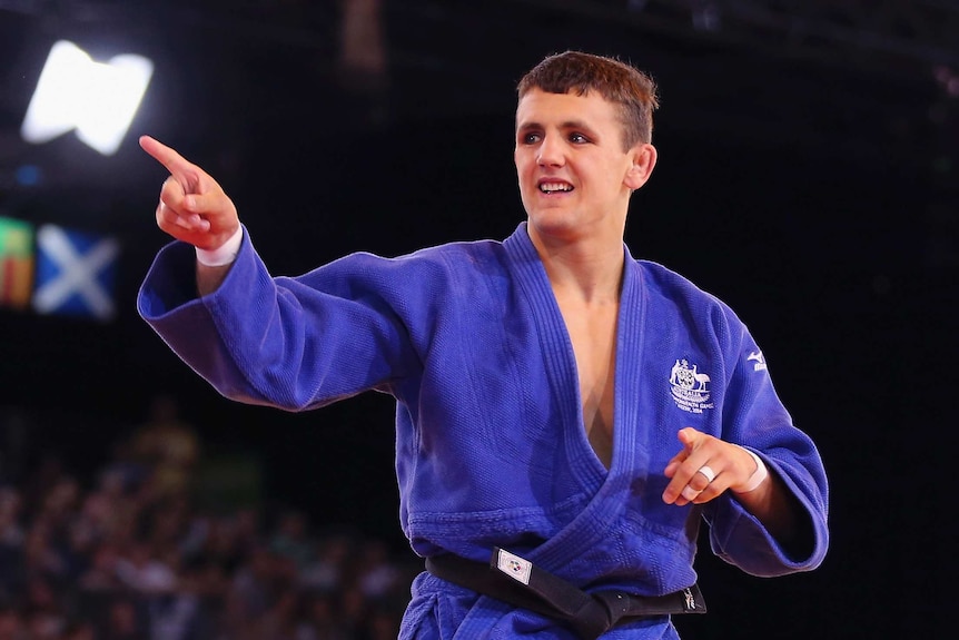 Jake Bensted celebrates after winning a judo bronze medal